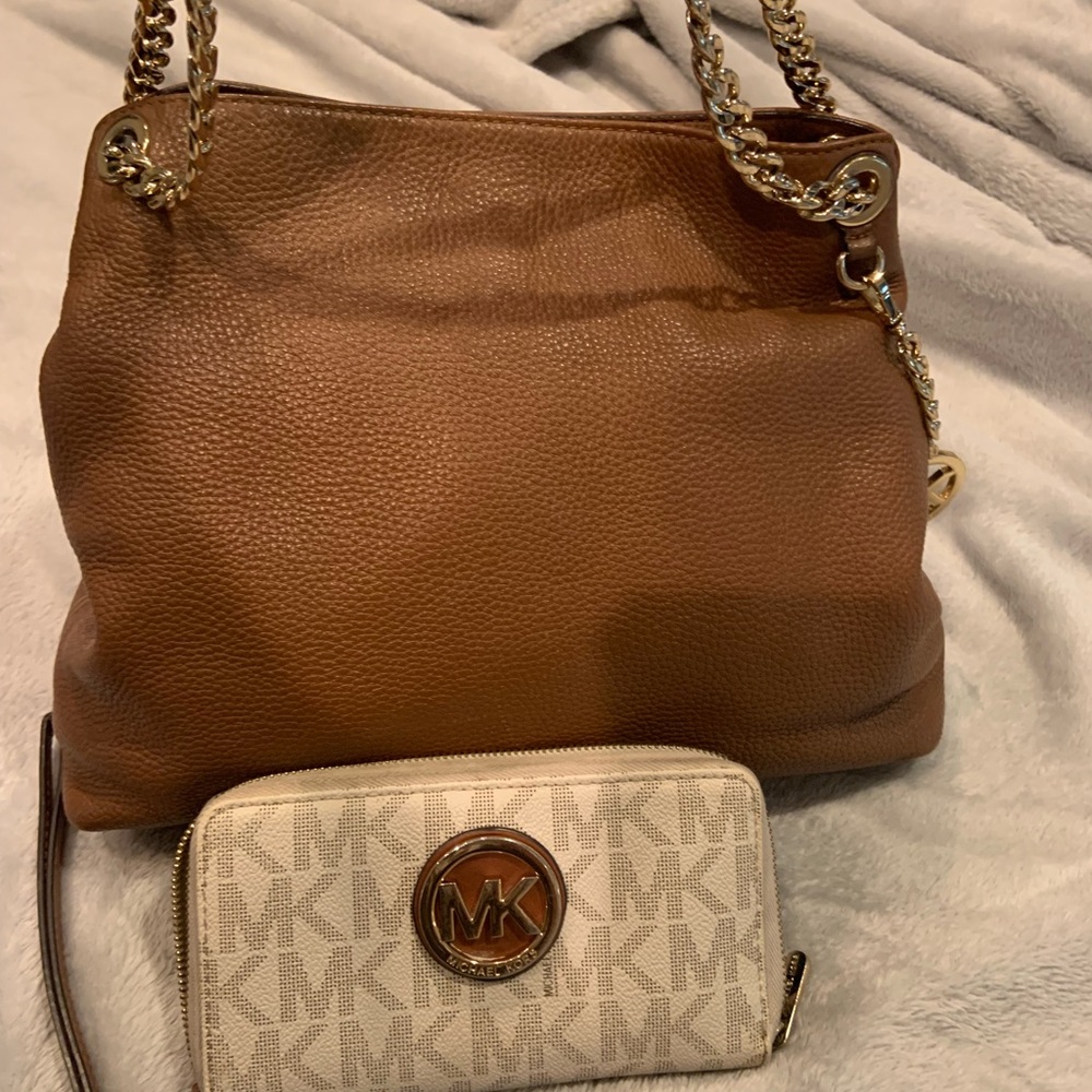 Michael Kors purse. Authentic with stains in interior. Wallet is included